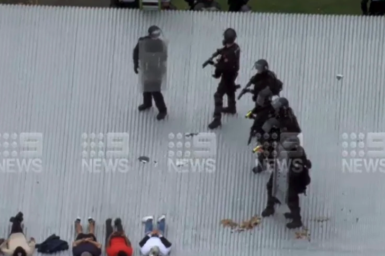 Officers storming the Banksia Hill Detention Centre rooftop on Wednesday | 9 NEWS PERTH